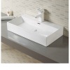 Glossy White Ceramic Counter Above Mounted Bathroom Basin